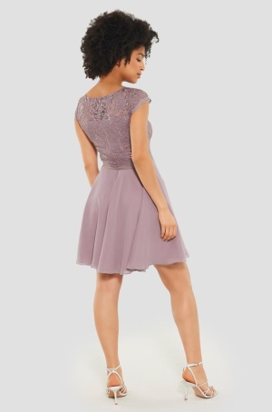 Swing női ruha derékban szabott,alúl muszlin,felül flitteres csipkés